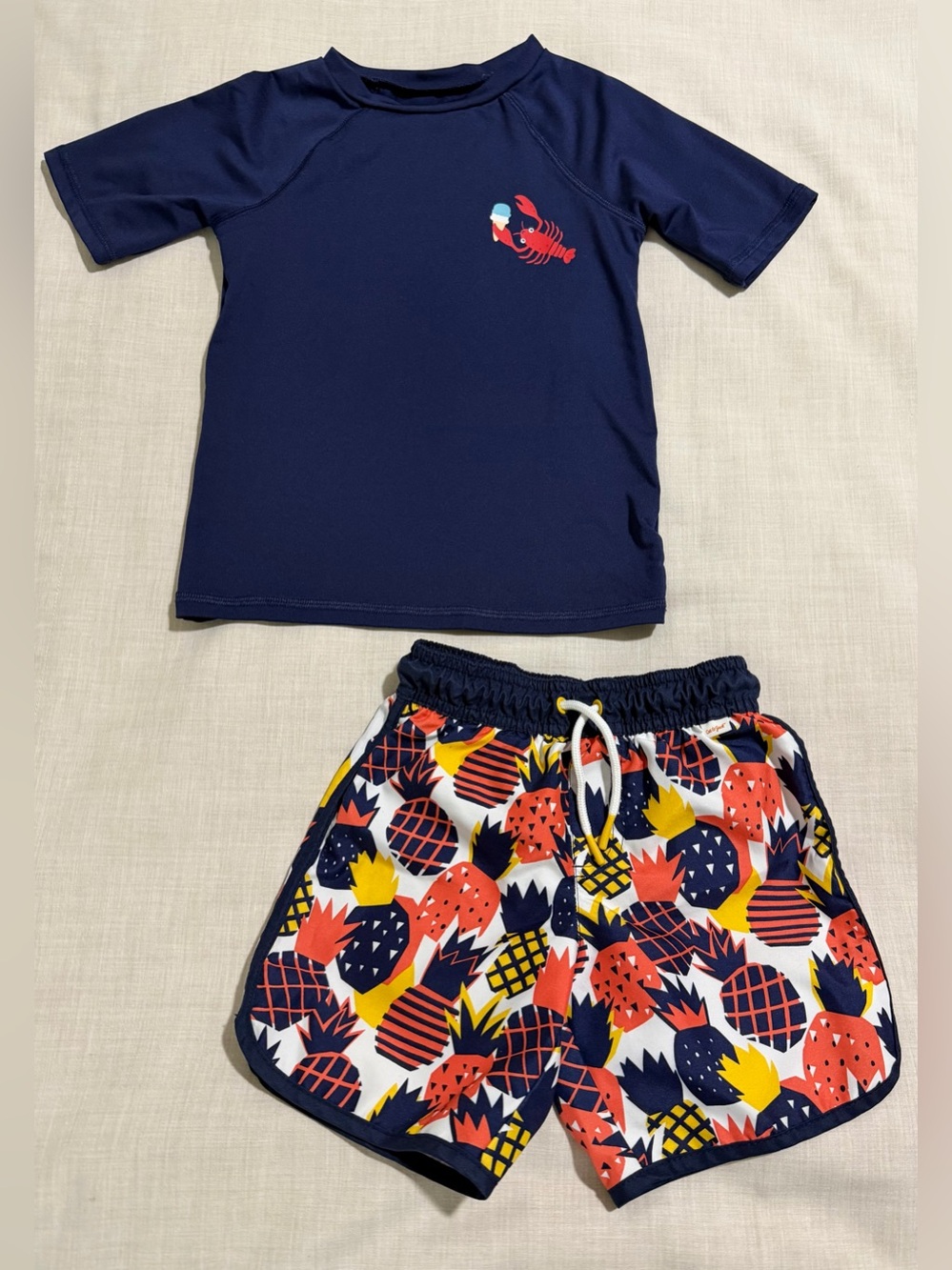 Cat & Jack Navy Rash Guard swim shorts, size 4T.
Swim shirt is size 5T.